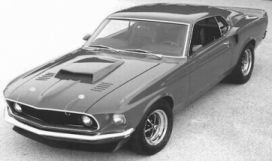 1969 Ford Mustang Mach 1 with front spoiler, 429 Boss hood scoop, hood louvers, and enhanced rear spoiler.